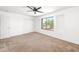 Bright bedroom featuring a ceiling fan, closet and view of the neighborhood at 2036 S Reseda Ct, Gilbert, AZ 85295