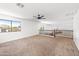Carpeted upstairs bonus room offering plenty of natural light and space for entertainment at 2036 S Reseda Ct, Gilbert, AZ 85295