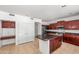 Kitchen with granite countertops, stainless steel refrigerator, and dark wood cabinets at 2036 S Reseda Ct, Gilbert, AZ 85295
