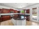 Gourmet kitchen featuring granite countertops, stainless steel appliances, and a center island at 2036 S Reseda Ct, Gilbert, AZ 85295