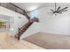 Bright and spacious living room featuring a soaring ceiling, a staircase, and ample natural light at 2036 S Reseda Ct, Gilbert, AZ 85295