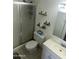 Bathroom with tiled floors, vanity, and shower with glass door at 2051 W Elm St, Phoenix, AZ 85015