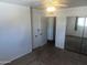 Bedroom with neutral carpet, a ceiling fan and closet with mirrored doors at 2051 W Elm St, Phoenix, AZ 85015