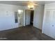 Spacious bedroom featuring neutral carpet, ceiling fan, and access to a bathroom at 2051 W Elm St, Phoenix, AZ 85015
