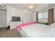 Bedroom with carpet, a ceiling fan, a white dresser with TV, and large closet at 2051 W Elm St, Phoenix, AZ 85015