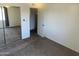 Bedroom featuring neutral carpet and closet with mirrored doors at 2051 W Elm St, Phoenix, AZ 85015
