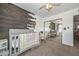Cozy bedroom with wood accent wall, closet with mirrored doors, and comfortable furnishings at 2051 W Elm St, Phoenix, AZ 85015