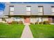 Charming townhome featuring a well-manicured lawn and a welcoming entrance at 2051 W Elm St, Phoenix, AZ 85015