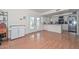 Spacious kitchen with white cabinets and french doors, offering ample room at 2051 W Elm St, Phoenix, AZ 85015