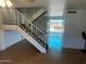 Open floorplan with wood flooring and staircase leading to the second level at 2051 W Elm St, Phoenix, AZ 85015