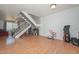 Open concept living area with laminate flooring, stairs, and plenty of space at 2051 W Elm St, Phoenix, AZ 85015