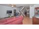 Bright living room featuring stairs, laminate floors, and comfortable furnishings at 2051 W Elm St, Phoenix, AZ 85015