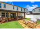 Spacious backyard featuring patio, fire pit area, lush turf and inviting places to sit at 20812 W Legend Trl, Buckeye, AZ 85396
