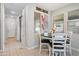 Bright dining area featuring tile floors, light walls, and a modern dining table with seating at 20812 W Legend Trl, Buckeye, AZ 85396
