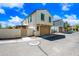 Charming two-story home with a well-maintained front yard and two-car garage at 20812 W Legend Trl, Buckeye, AZ 85396
