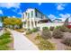 Charming two-story home with landscaped yard, flowers and a walkway at 20812 W Legend Trl, Buckeye, AZ 85396