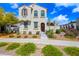 Charming two-story home with landscaped yard, walkway and brown front door at 20812 W Legend Trl, Buckeye, AZ 85396