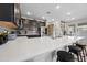 Elegant kitchen with white countertops, dark cabinetry, and stainless-steel appliances at 20812 W Legend Trl, Buckeye, AZ 85396