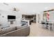 Open-concept kitchen featuring dark cabinetry, white countertops, and modern stainless-steel appliances at 20812 W Legend Trl, Buckeye, AZ 85396