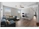 Inviting living room with a comfortable sofa, ample natural light, and a dedicated workspace at 20812 W Legend Trl, Buckeye, AZ 85396