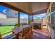 Inviting covered patio features outdoor dining set and hot tub for relaxing and entertaining at 20812 W Legend Trl, Buckeye, AZ 85396