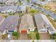 An aerial view of a single-Gathering home featuring desert landscaping, a tile roof, and a red garage door at 22560 E Rosa Rd, Queen Creek, AZ 85142