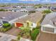 Aerial view of home featuring a red garage door, desert landscaping, and a tile roof at 22560 E Rosa Rd, Queen Creek, AZ 85142