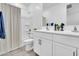 Clean and well-lit bathroom with a double sink vanity and tub-shower combination at 22560 E Rosa Rd, Queen Creek, AZ 85142