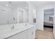 Bathroom features double sink vanity with large mirror and walk-in shower at 22560 E Rosa Rd, Queen Creek, AZ 85142