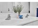 Bright bathroom featuring a double vanity with elegant chrome fixtures and decorative accents at 22560 E Rosa Rd, Queen Creek, AZ 85142