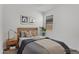 Bright bedroom with carpet, natural lighting, and a side table at 22560 E Rosa Rd, Queen Creek, AZ 85142