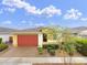 Inviting home exterior with a spacious driveway and meticulously maintained landscaping at 22560 E Rosa Rd, Queen Creek, AZ 85142