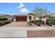 Charming single-story home with a two-car garage, desert landscaping, and a welcoming front entrance at 22560 E Rosa Rd, Queen Creek, AZ 85142