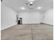 Spacious and bright garage featuring concrete floors, a water heater, and water filtration at 22560 E Rosa Rd, Queen Creek, AZ 85142