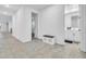 Bright hallway with tile flooring, neutral walls and ample natural light at 22560 E Rosa Rd, Queen Creek, AZ 85142
