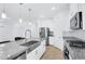 Bright kitchen features granite countertops, stainless steel appliances, and modern fixtures at 22560 E Rosa Rd, Queen Creek, AZ 85142