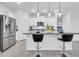 Modern kitchen featuring stainless steel appliances, granite countertops, pendant lighting, and a spacious island at 22560 E Rosa Rd, Queen Creek, AZ 85142