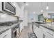 Modern kitchen featuring stainless steel appliances and granite countertops at 22560 E Rosa Rd, Queen Creek, AZ 85142