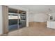 Open-concept living area with tile floors, neutral paint, a sliding door, and kitchen access at 22560 E Rosa Rd, Queen Creek, AZ 85142