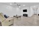 Spacious living room featuring tile floors, modern ceiling fan, and a comfortable seating area at 22560 E Rosa Rd, Queen Creek, AZ 85142