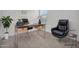 Modern home office featuring a sleek desk, ergonomic chairs, and natural light at 22560 E Rosa Rd, Queen Creek, AZ 85142
