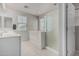 Bright bathroom with dual sink vanity, shower, and a soaking tub, offering a relaxing and functional space at 2559 N 73Rd Dr, Phoenix, AZ 85035