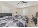 Shared bedroom featuring two beds, wood detail headboards, and neutral walls, creating a versatile living space at 2559 N 73Rd Dr, Phoenix, AZ 85035