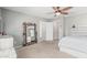 Spacious bedroom featuring neutral colors, a ceiling fan, and carpet flooring, creating a comfortable retreat at 2559 N 73Rd Dr, Phoenix, AZ 85035