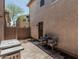 Private outdoor patio featuring a stone seating area and grill, creating an ideal space for outdoor enjoyment at 2559 N 73Rd Dr, Phoenix, AZ 85035