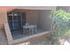 Covered patio with tiled table and chairs, offering an outdoor dining space at 3031 N Civic Center Plz # 113, Scottsdale, AZ 85251