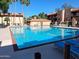 Community swimming pool with lounge chairs, perfect for relaxation and recreation at 3031 N Civic Center Plz # 113, Scottsdale, AZ 85251