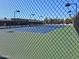 Tennis court surrounded by a fence, providing recreational opportunities at 3031 N Civic Center Plz # 113, Scottsdale, AZ 85251