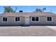 Charming single-story home with freshly painted exterior, updated windows, gravel yard, and manicured landscaping at 3049 W Dahlia Dr, Phoenix, AZ 85029