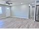 Spacious living room boasts new tile floors, fresh paint, open floor plan, and an abundance of natural light at 3049 W Dahlia Dr, Phoenix, AZ 85029